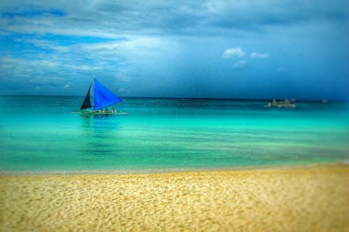 Painting of Blue Boat on Beach