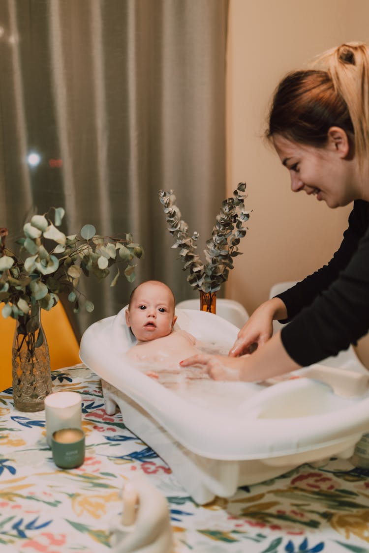 A Mother Bathing Her Baby