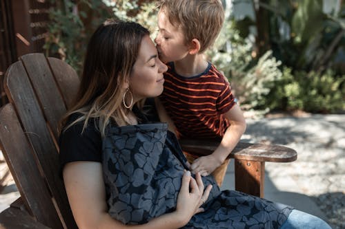 Kid Kissing a Woman