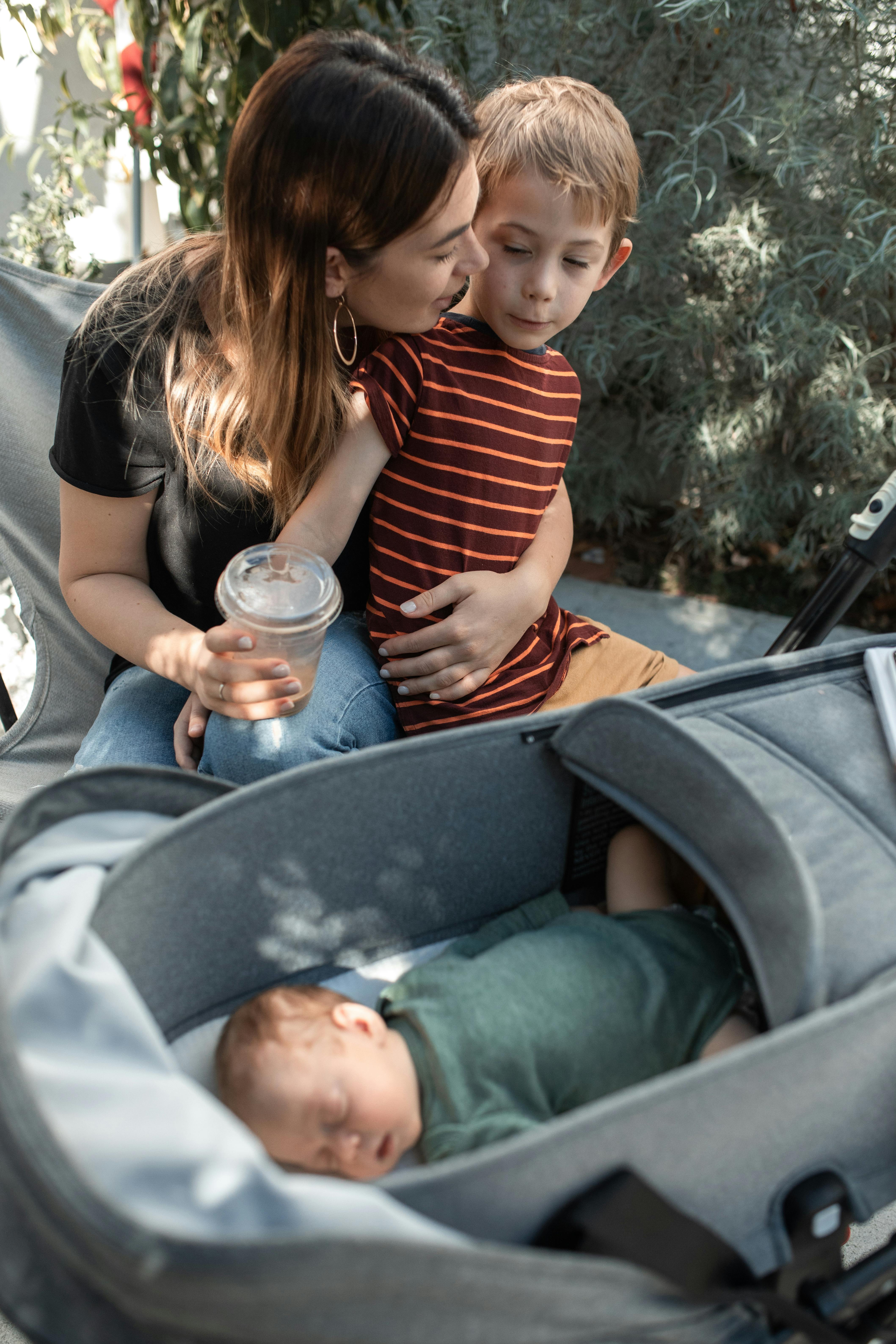 woman in red and white striped shirt sitting on black car seat