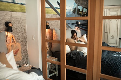 A Woman Resting in Bed Cuddling Her Baby