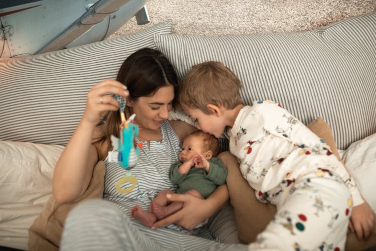 A Mother Lying With Two Sons 