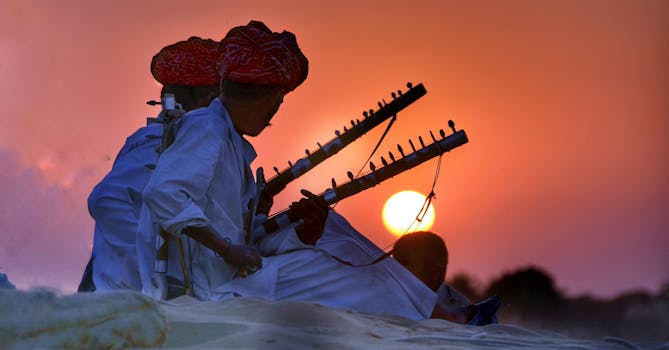 Indian musicians playing string instruments at sunset, showcasing rich cultural heritage.