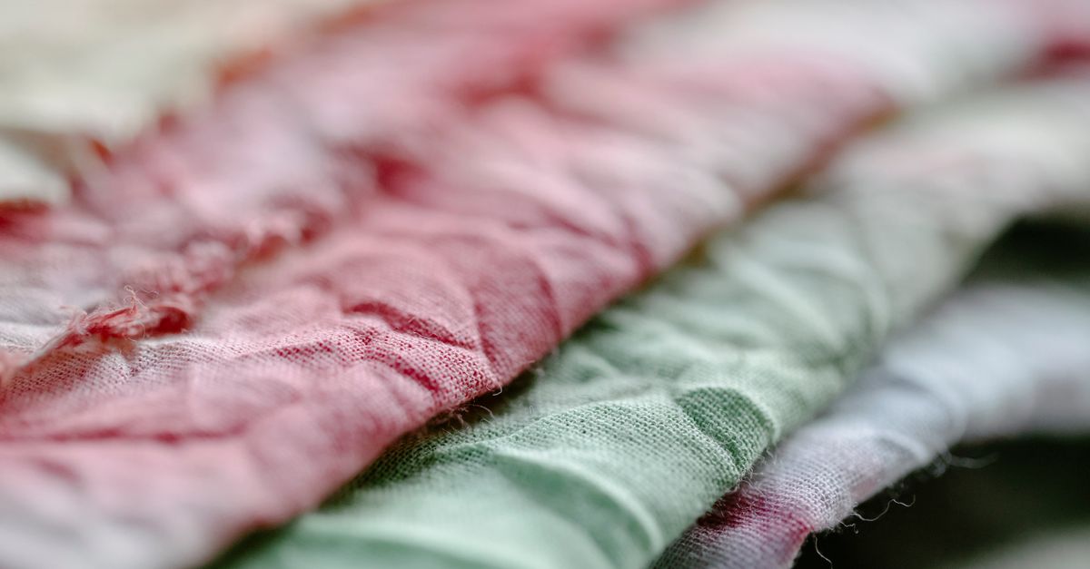 Textile Rmpled Pile of crumpled fabric in studio ยท Free Stock Photo