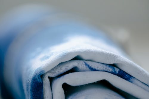 Free Rolled textile in light workshop Stock Photo