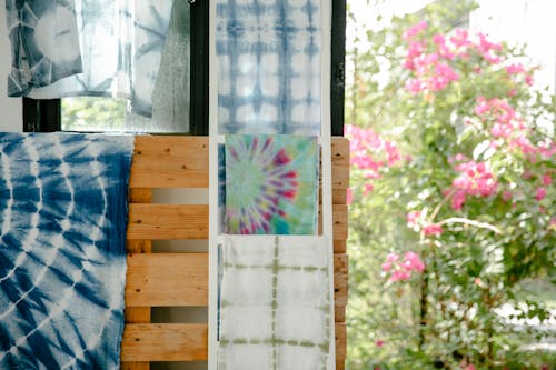 Free Elegant linen fabrics manually tie dyed in shibori technique hanging in atelier Stock Photo