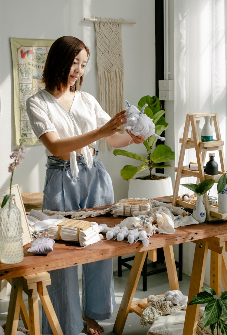 Young Asian Female Artist Preparing Textile For Tie Dye