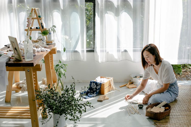 Ethnic Artisan Preparing Poles For Shibori At Home