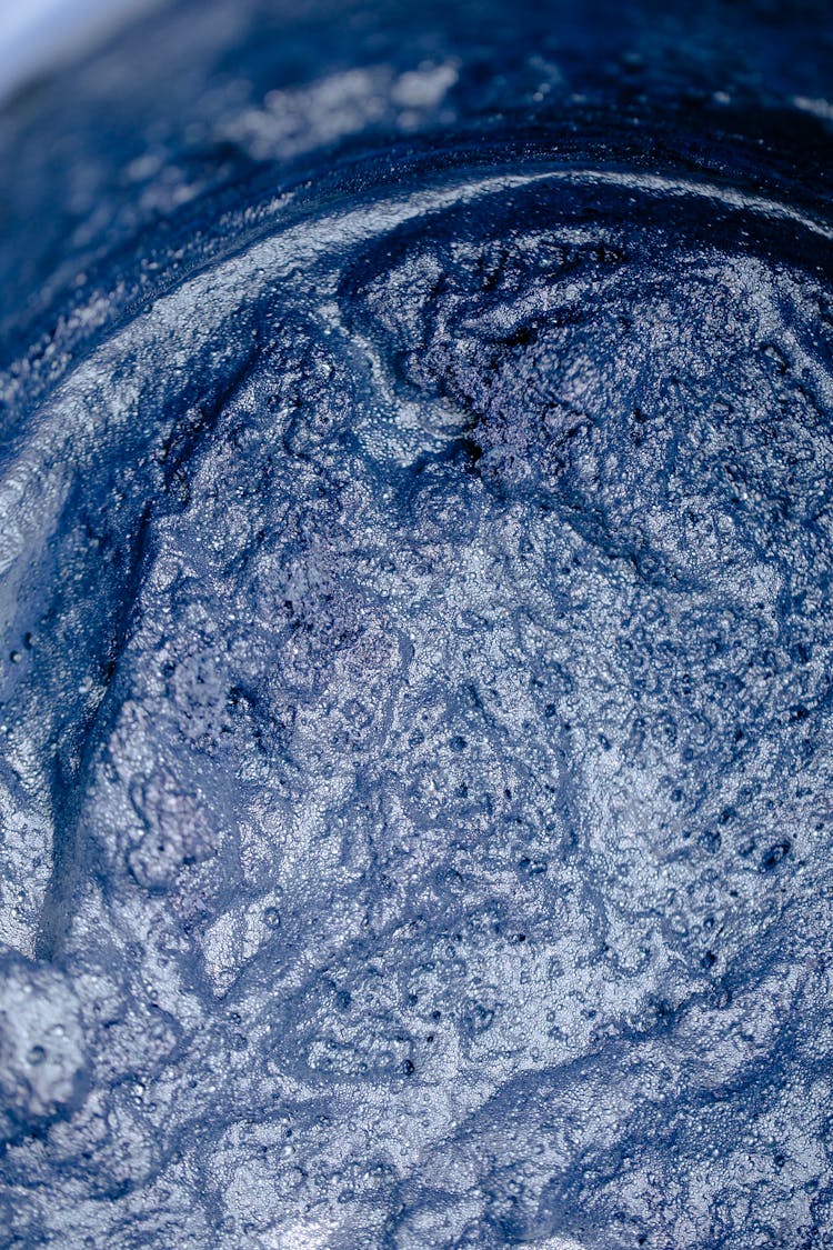 Abstract Background Of Blue Paint Flows With Shiny Surface