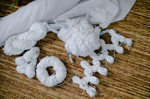 Folded textile things prepared for shibori coloring
