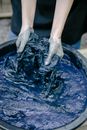Person Washing Blue Plastic Basin