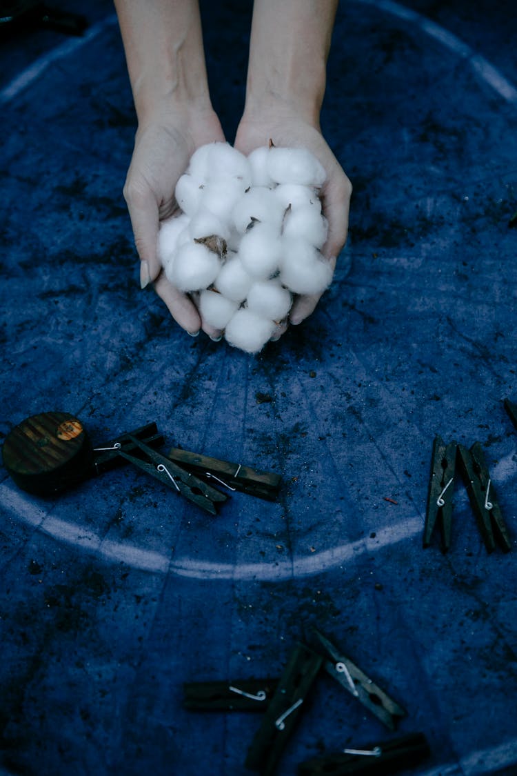 Woman Holding Cotton Balls 