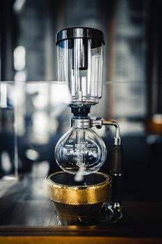 Professional vacuum coffeemaker on table