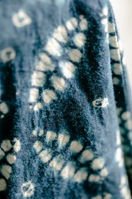 Bandhani dots resisted on indigo cloth — Photo by Teona Swift on Pexels