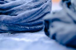 Creased indigo linen ready for cutting — Photo by Teona Swift on Pexels