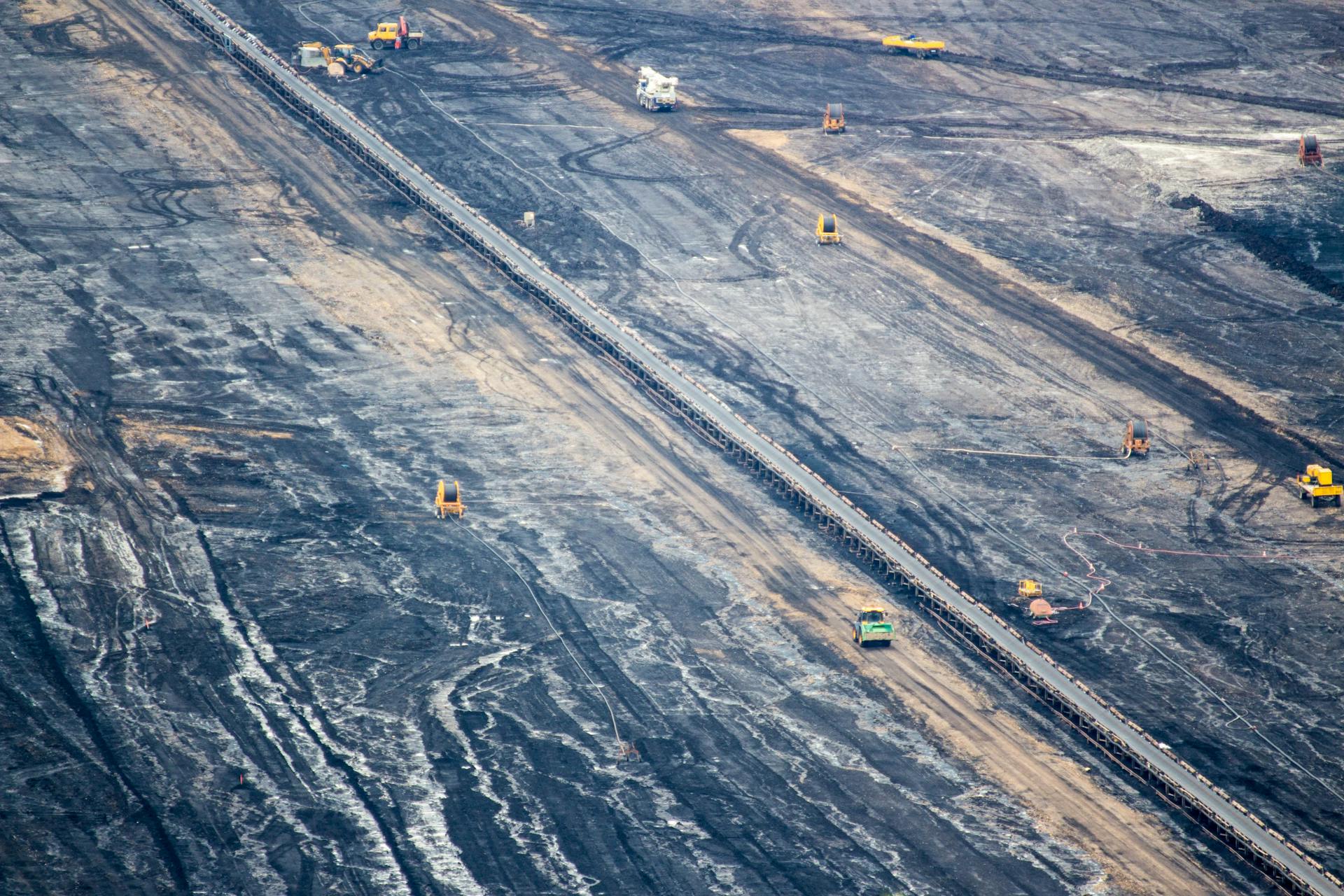 Aerial perspective of an expansive open-pit mine in Inden, Germany showcasing industrial mining operations.