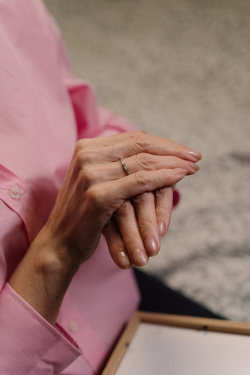 Hands of Woman in Pink Coat