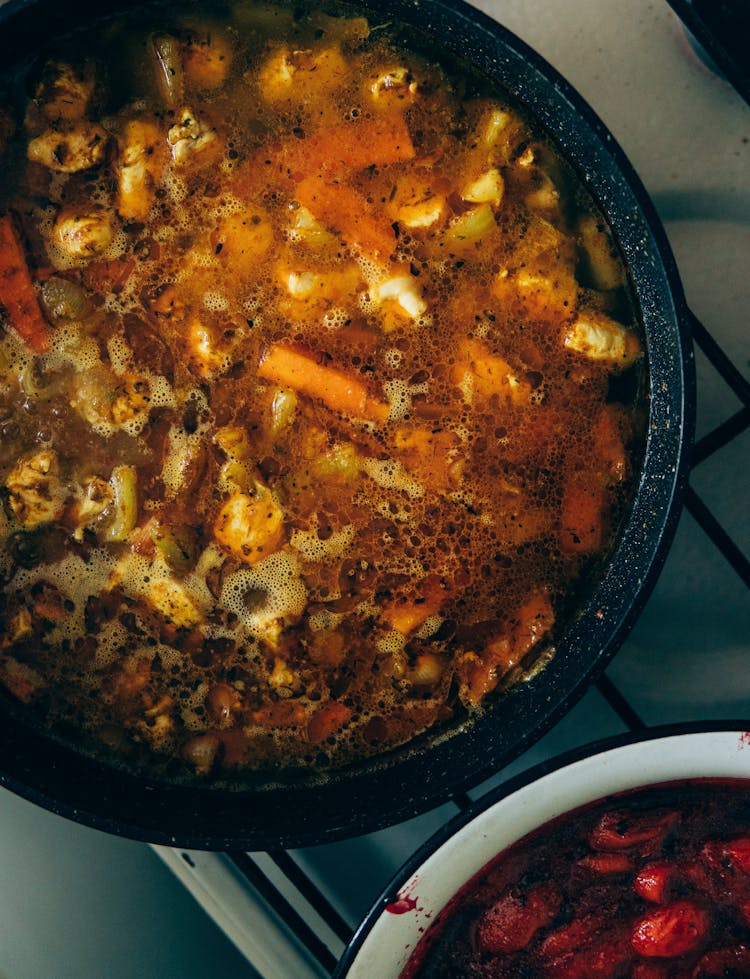 Appetizing Vegetable Soup In Saucepan Placed On Stove