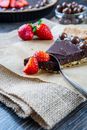 Strawberry and Chocolate Cake on White Textile