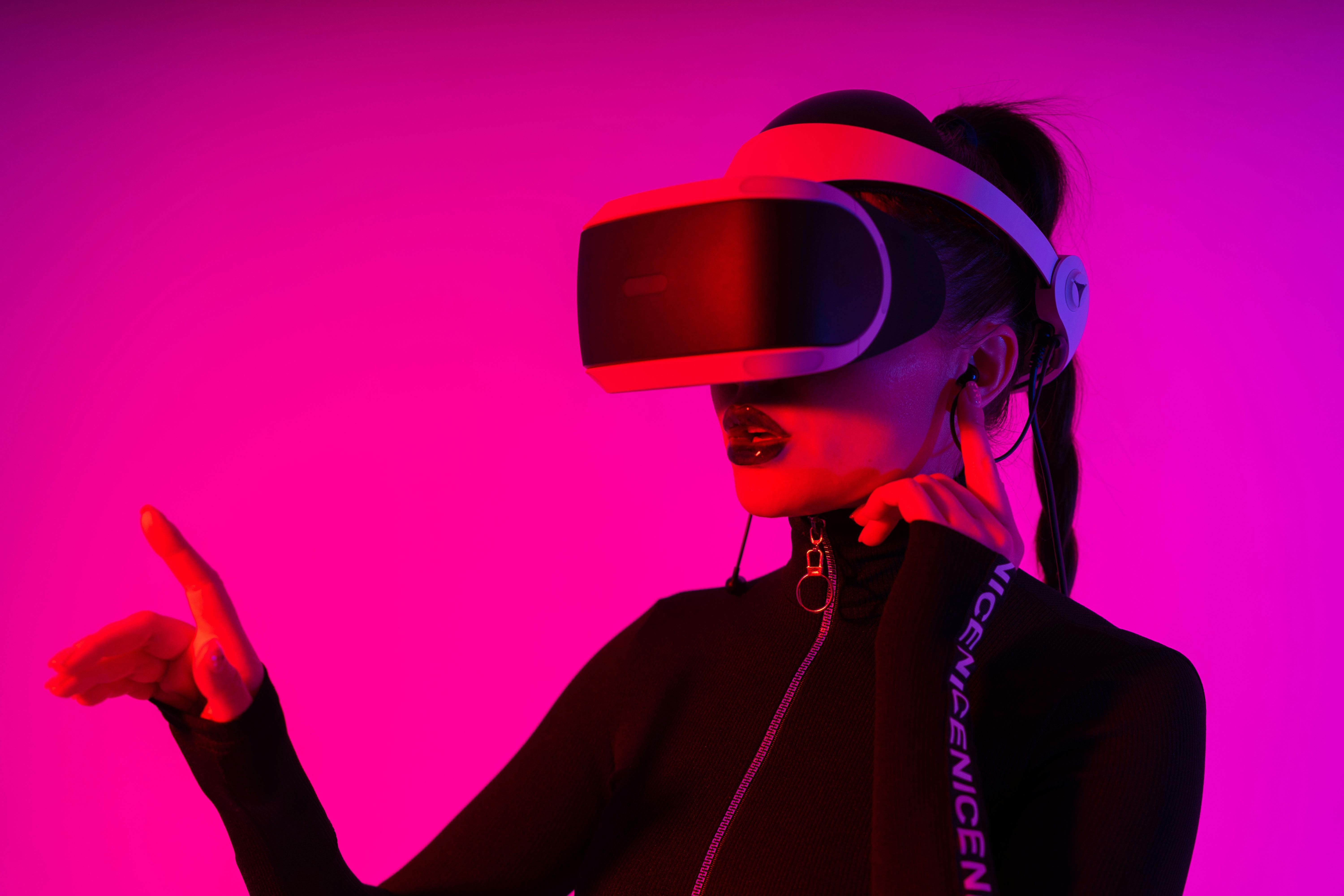 Woman in VR helmet exploring virtual reality · Free Stock Photo