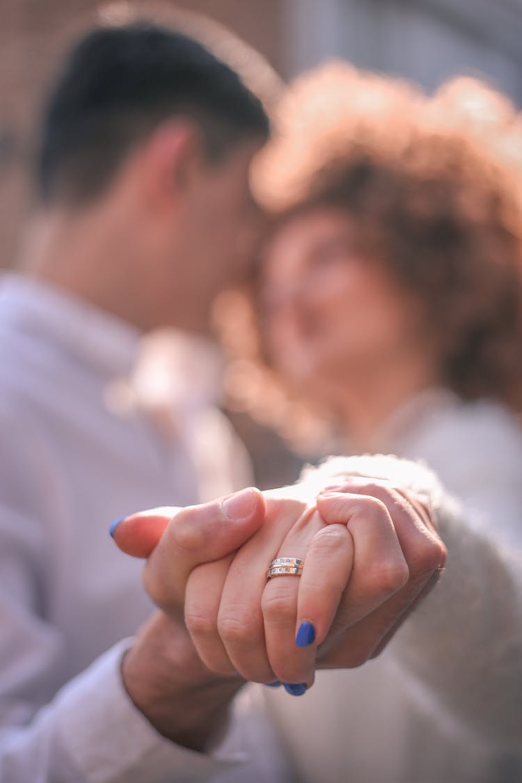 Crop Bride And Groom Holding Hands In Dance