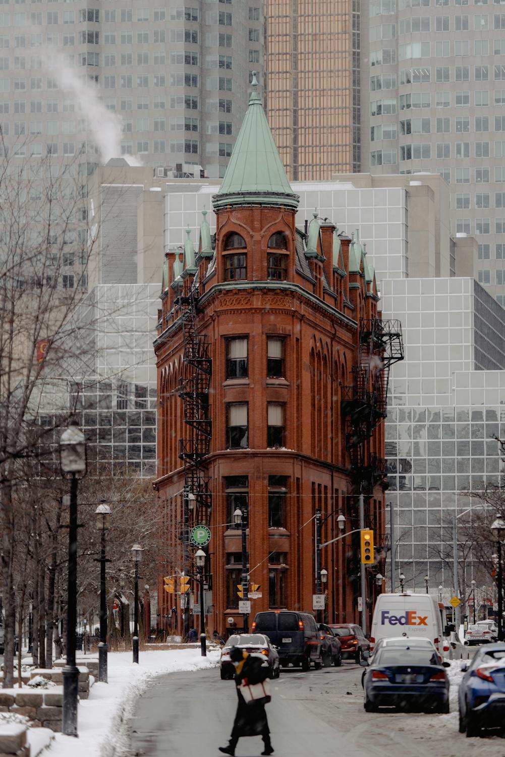 Historic Gooderham building on snowy street · Free Stock Photo