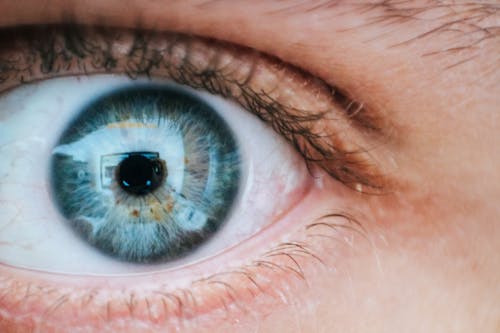 Free Person With Teal and Yellow Left Eye Stock Photo