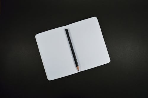 Free Black Pencil on White Paper Stock Photo