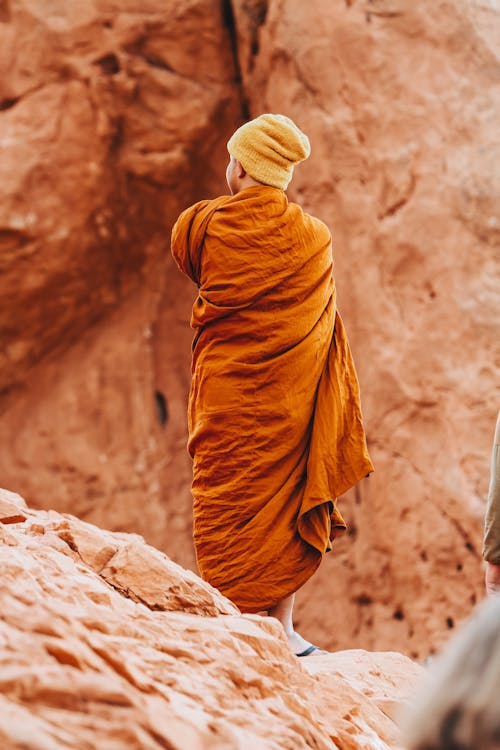 A Monk Standing in Mountains 