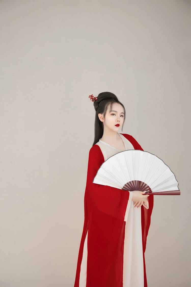 Woman Holding A Fan