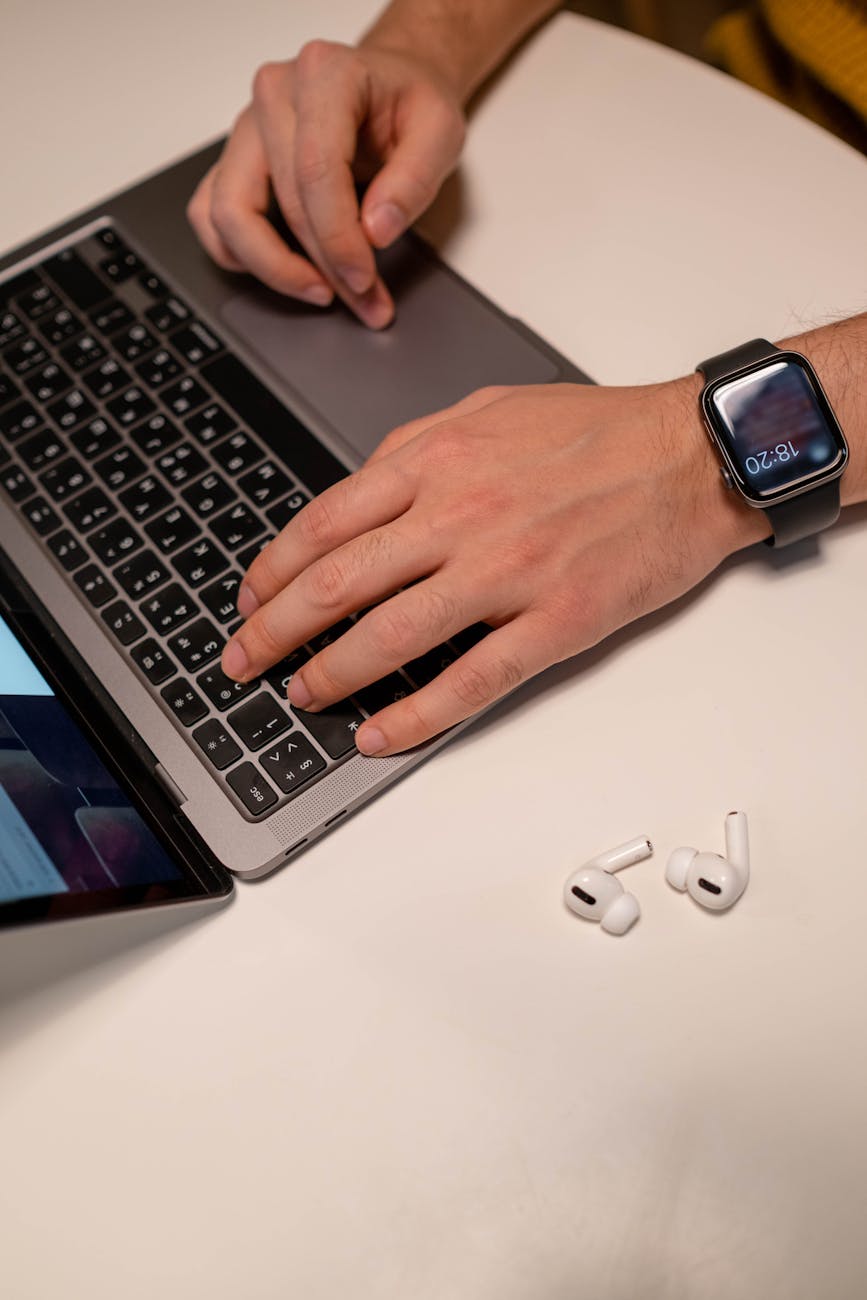 Black Apple Watch on the Person's Hand