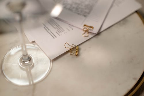 Documents with Paper Clips on Table