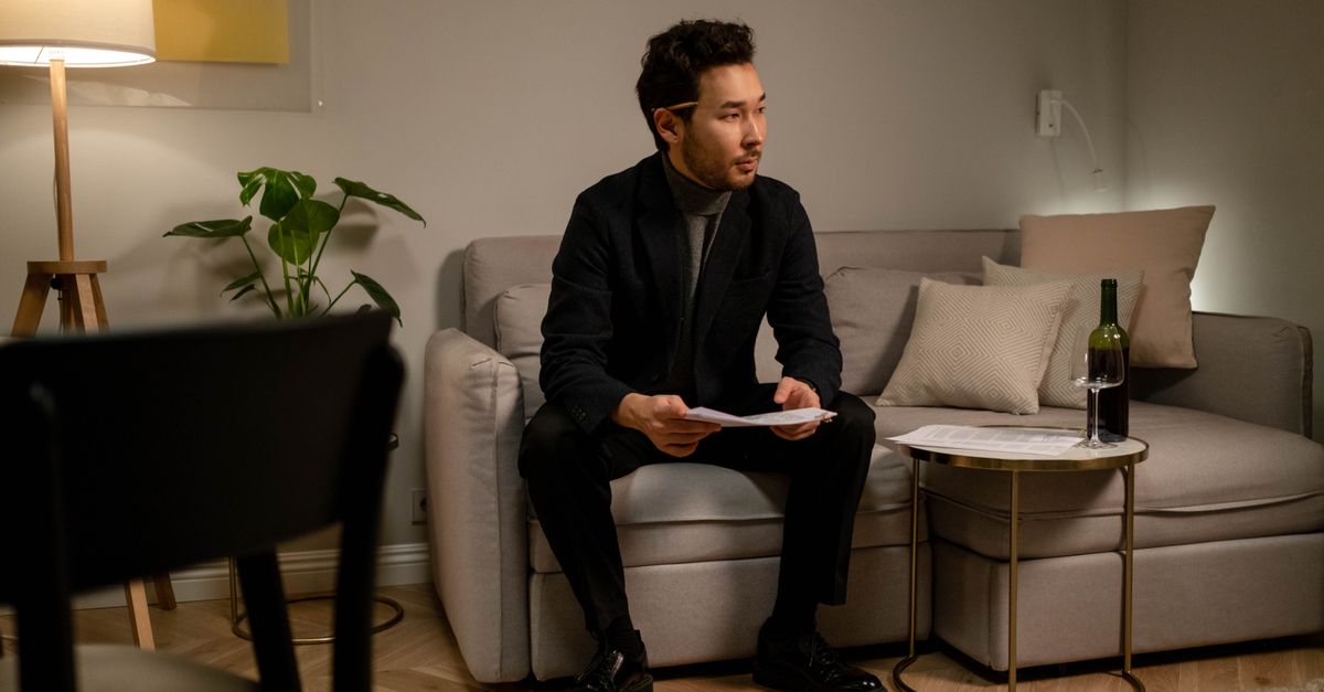 person standing up from couch, determined expression