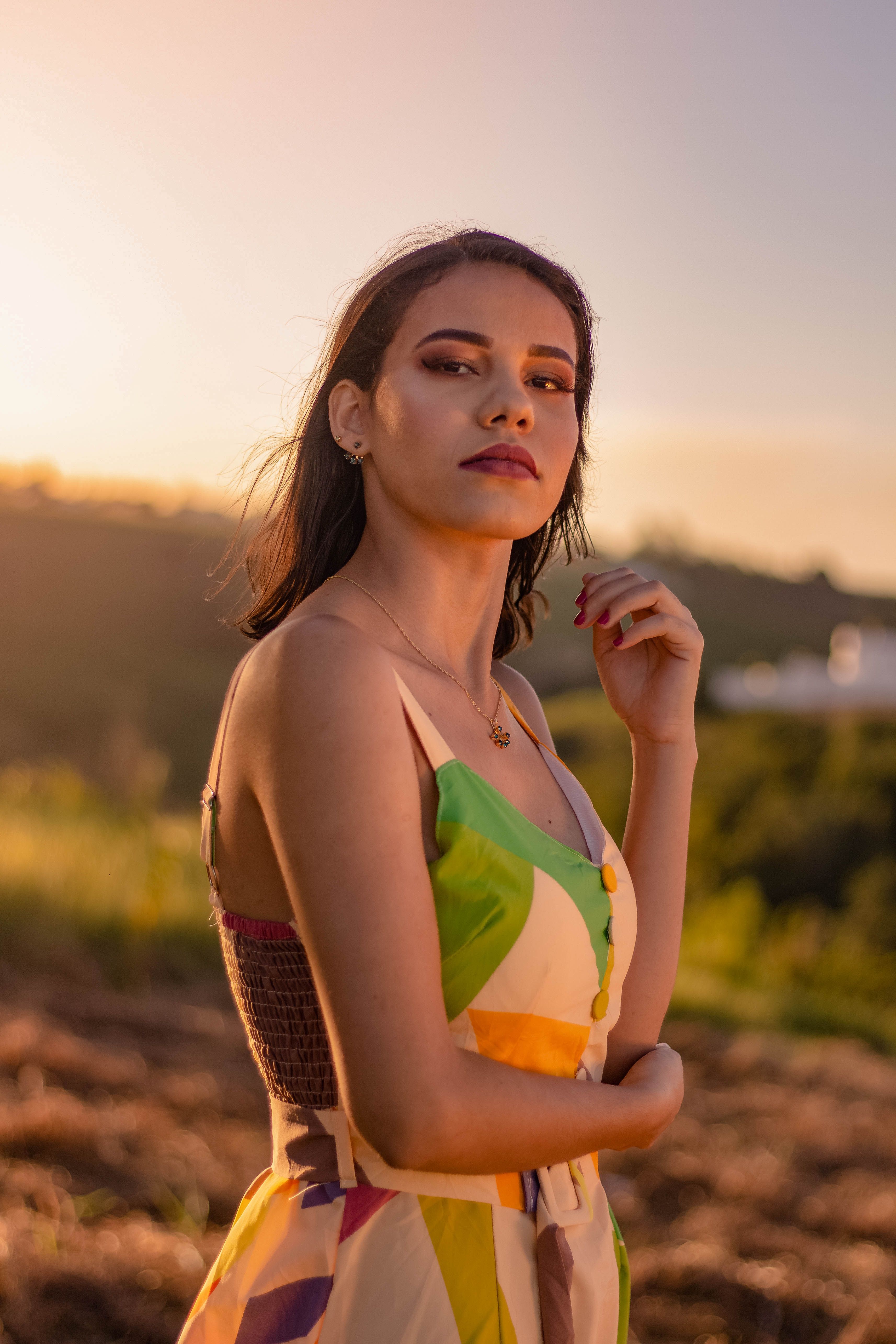 Selective Focus Photo of a Woman in a Colorful Dress Looking at the ...