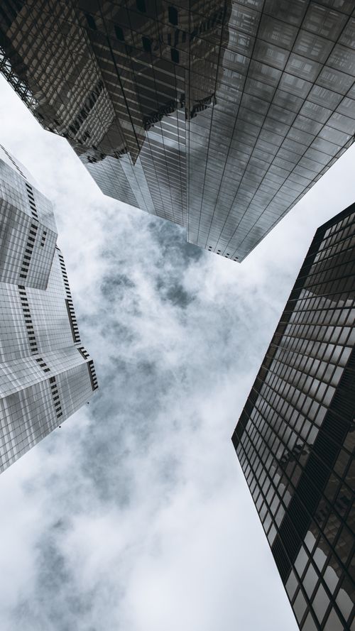 Free Low angle view of London skyscrapers against a cloudy sky, showcasing modern architecture. Stock Photo