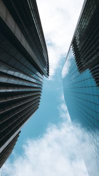 Stunning vertical shot of modern skyscrapers against the sky in London.