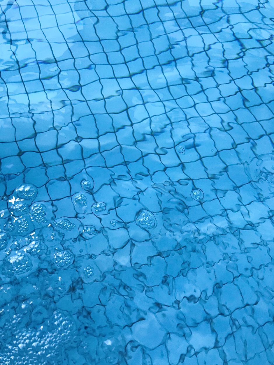 Bill Wendorf's Pool Services - Close-up of clean blue pool water with shimmering ripples