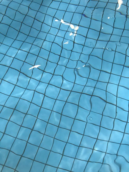 Free Swimming pool with water and blue bottom Stock Photo
