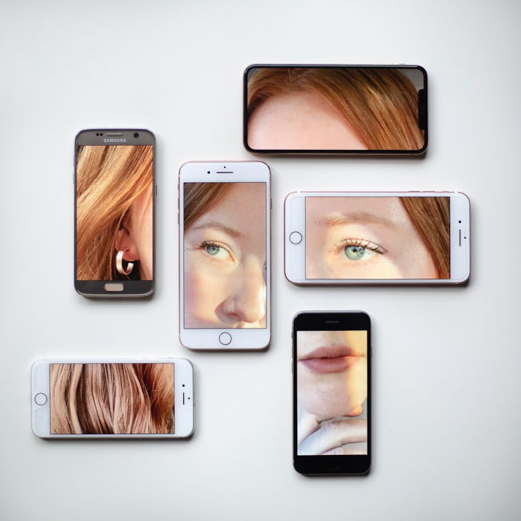 Collage Of Smartphones With Woman Portrait On Surface