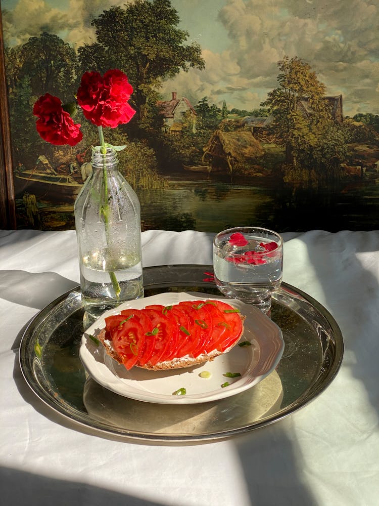 Tray With Sandwich With Tomatoes Near Glass And Flower