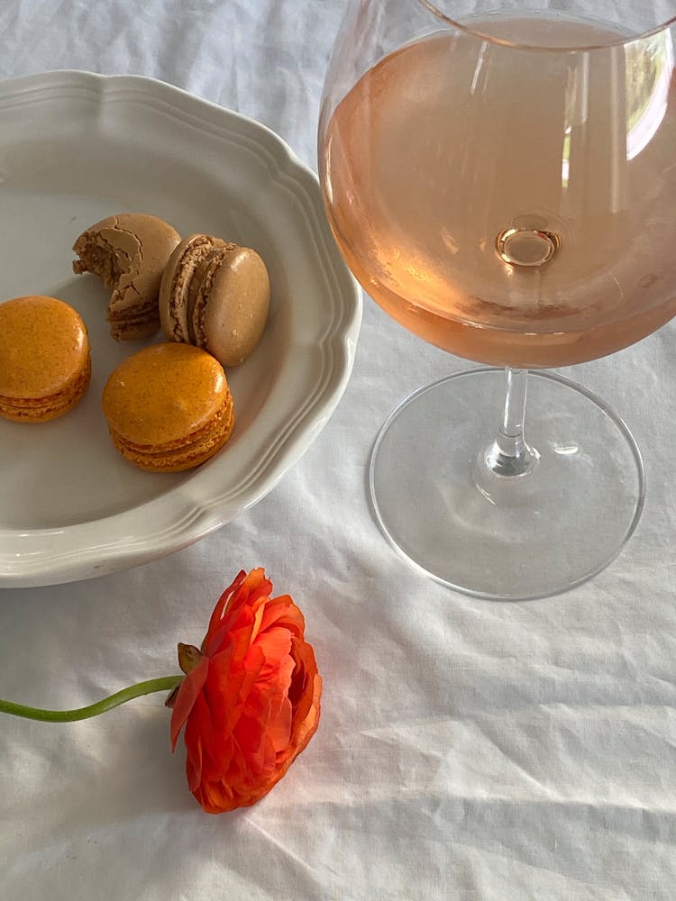 Glass Of Rose Wine Placed Near Sweet Macaron