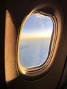 View from plane window on fluffy clouds