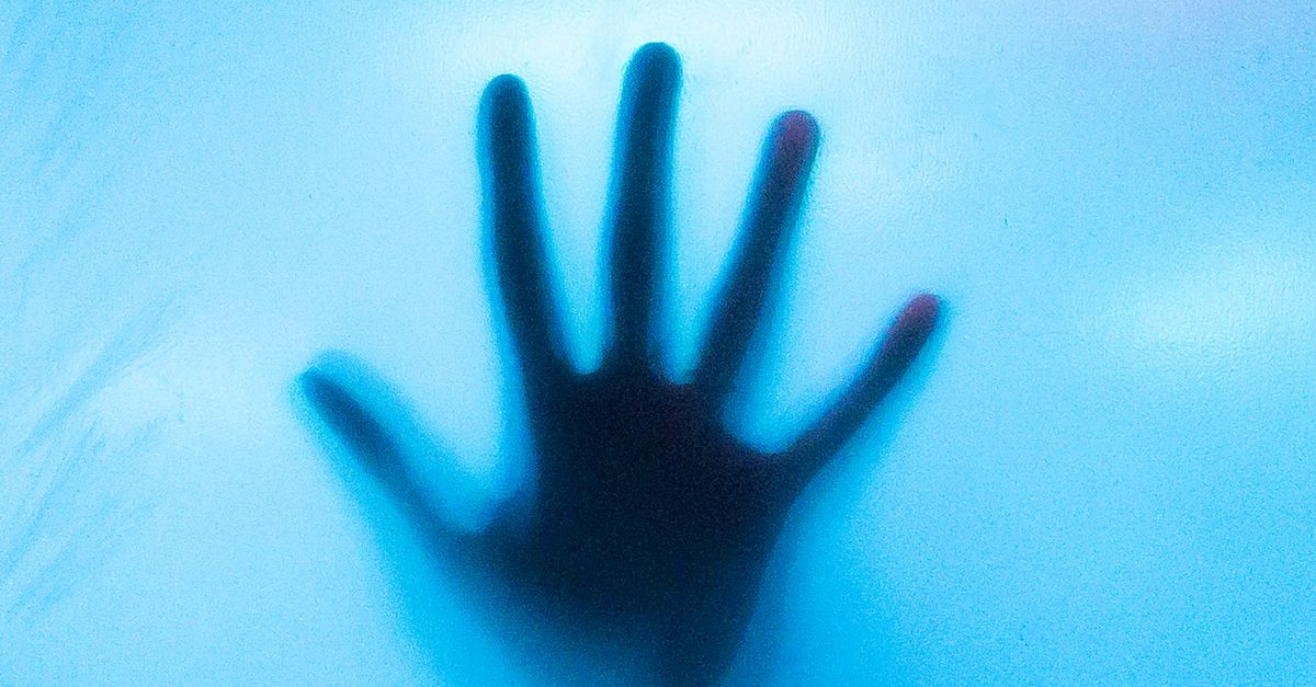 A Hand on a Blue Translucent Object · Free Stock Photo