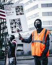 Multiethnic people with banners protesting against genocide