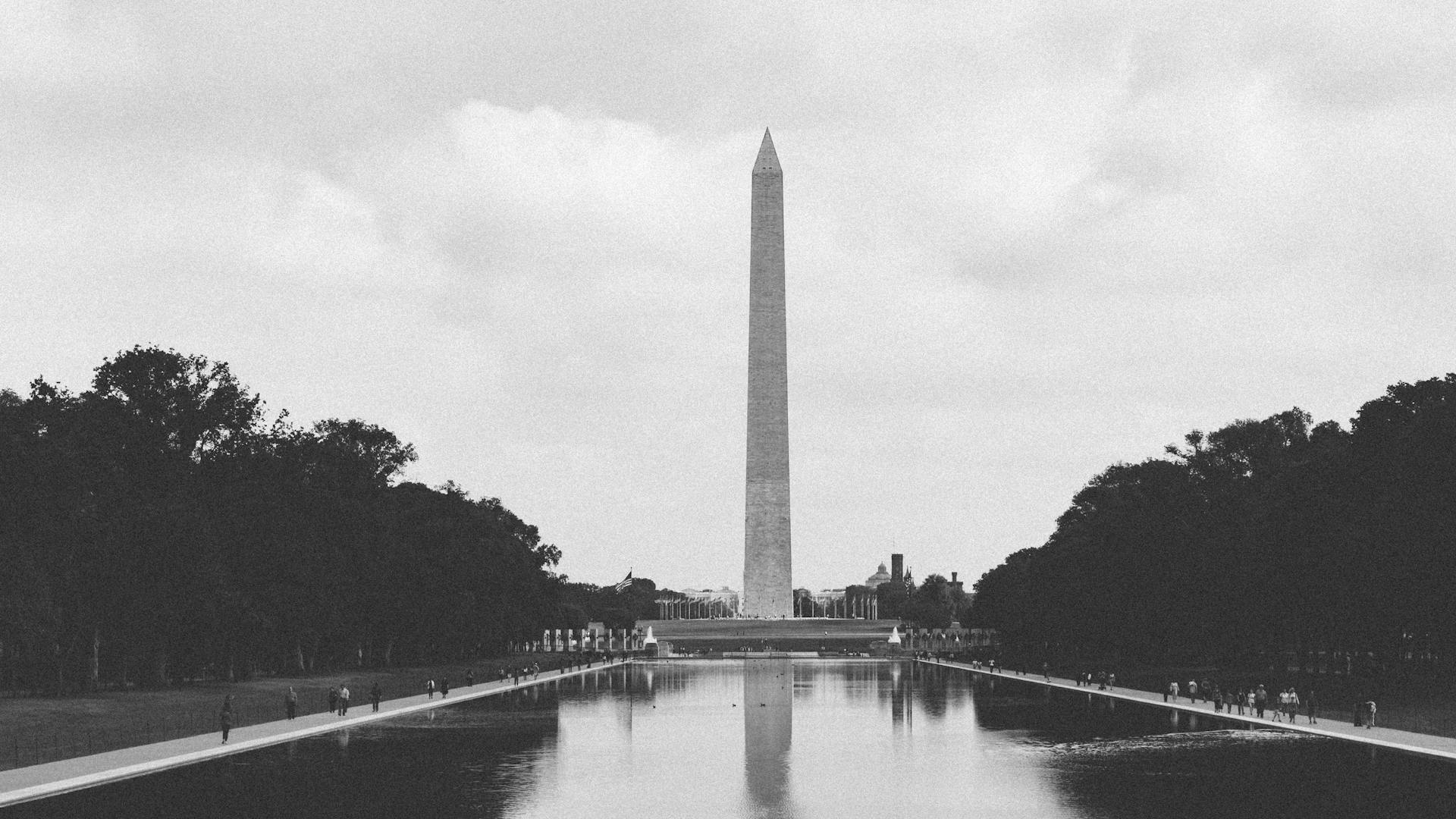 Black-and-white image of Washington Monument reflecting in the pool, Washington, D.C.