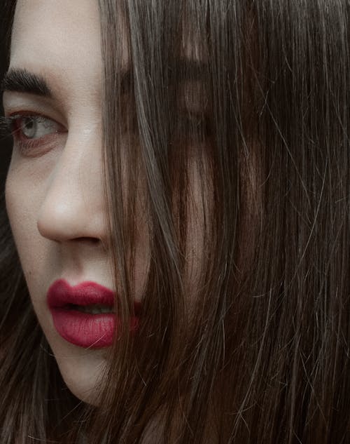 Close-Up Photo of a Beautiful Woman with Red Lips