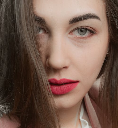 Close-Up Shot of an Attractive Woman Looking at Camera