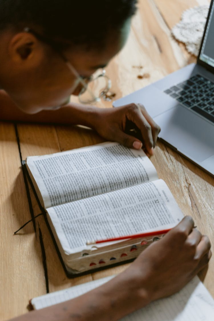 Man Wearing Eyeglasses Reading Bible