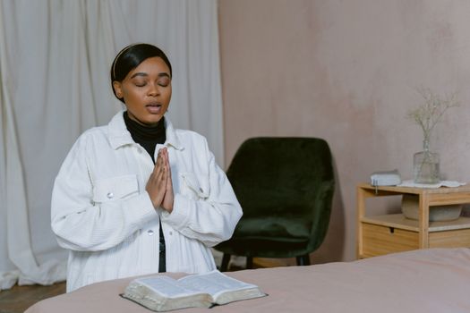 Woman in White Jacket Praying