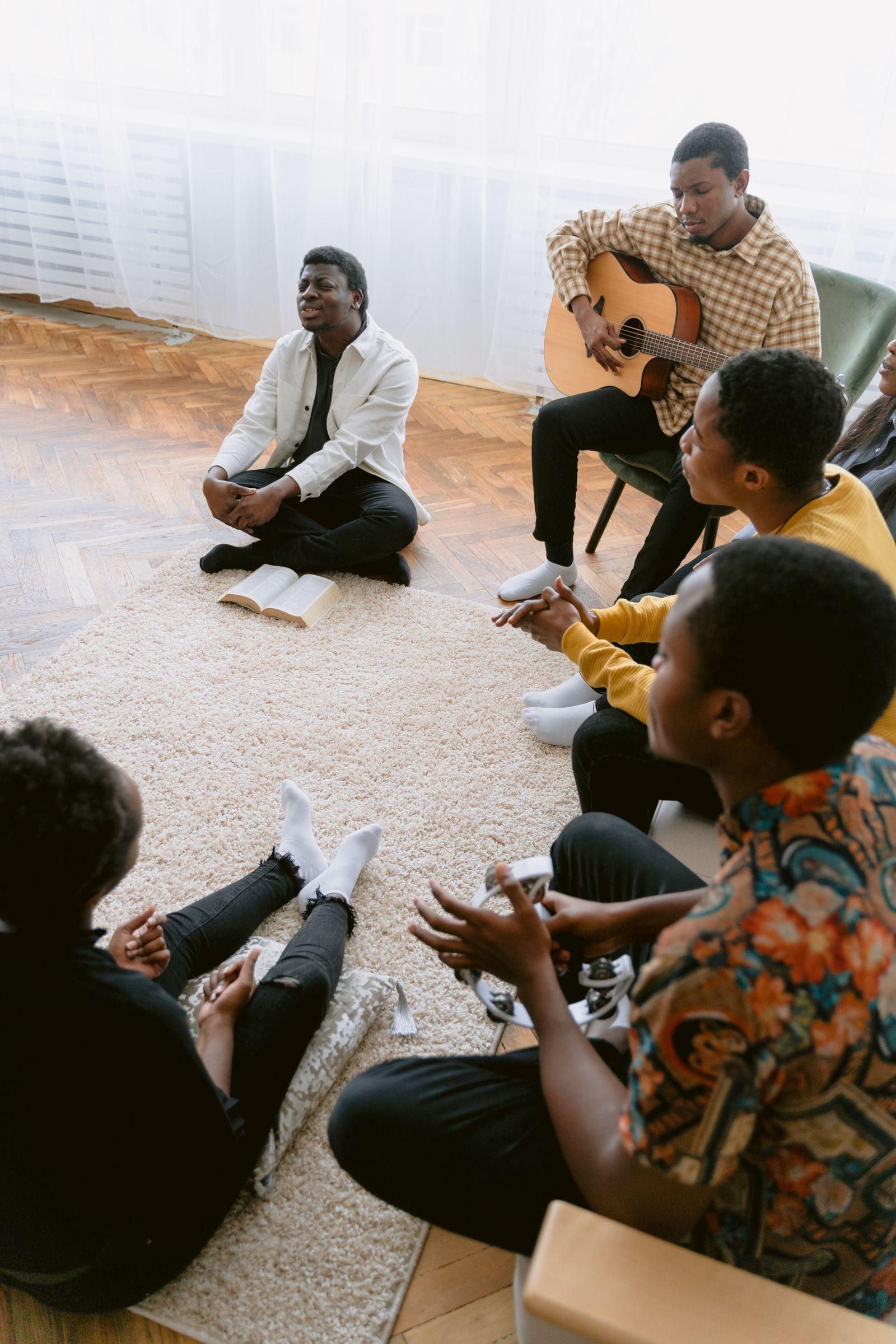 A small group gathered together in prayer